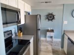Full size kitchen with full size refrigerator